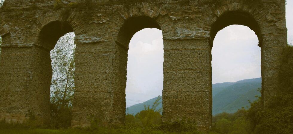 B&W photo of stone archways